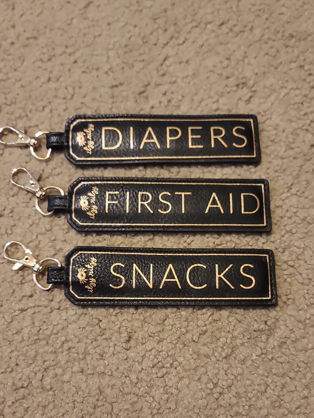 Itzy Ritzy Black and Gold 'Diapers/First Aid/Snacks' Organizer Key Tags